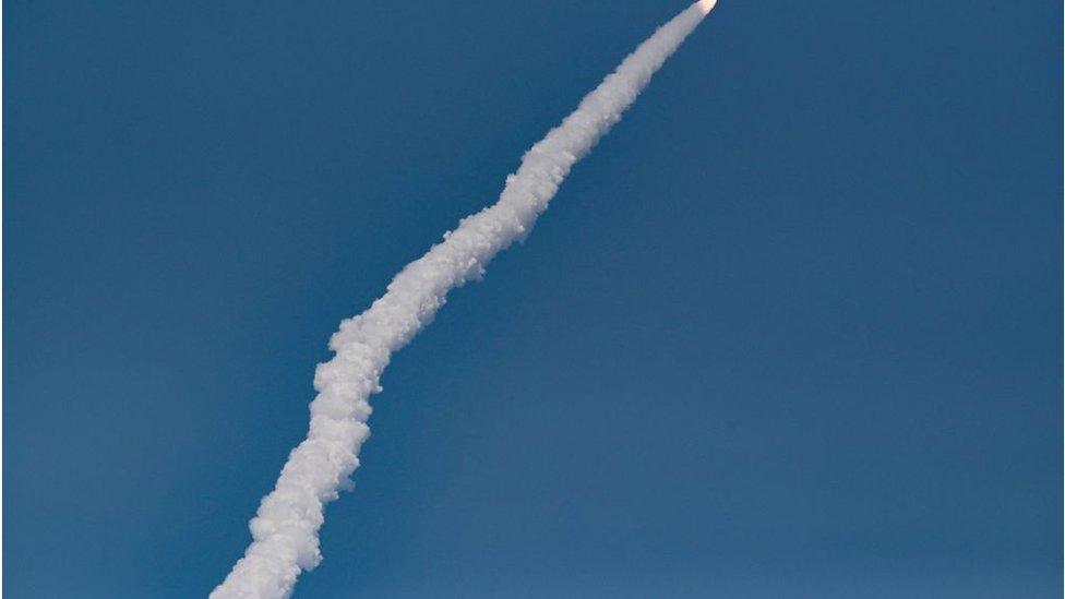 Rocket leave trail of smoke flying into space