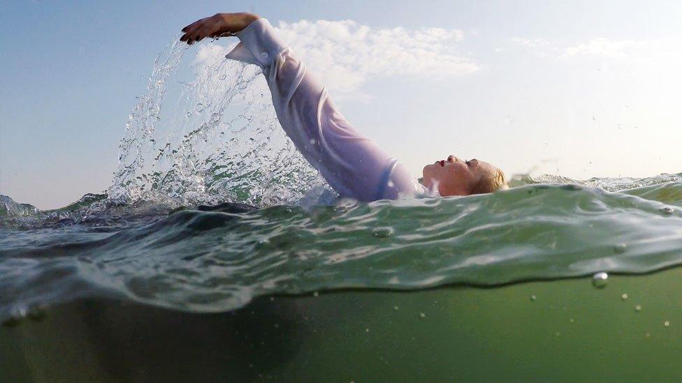 A woman floating in the sea