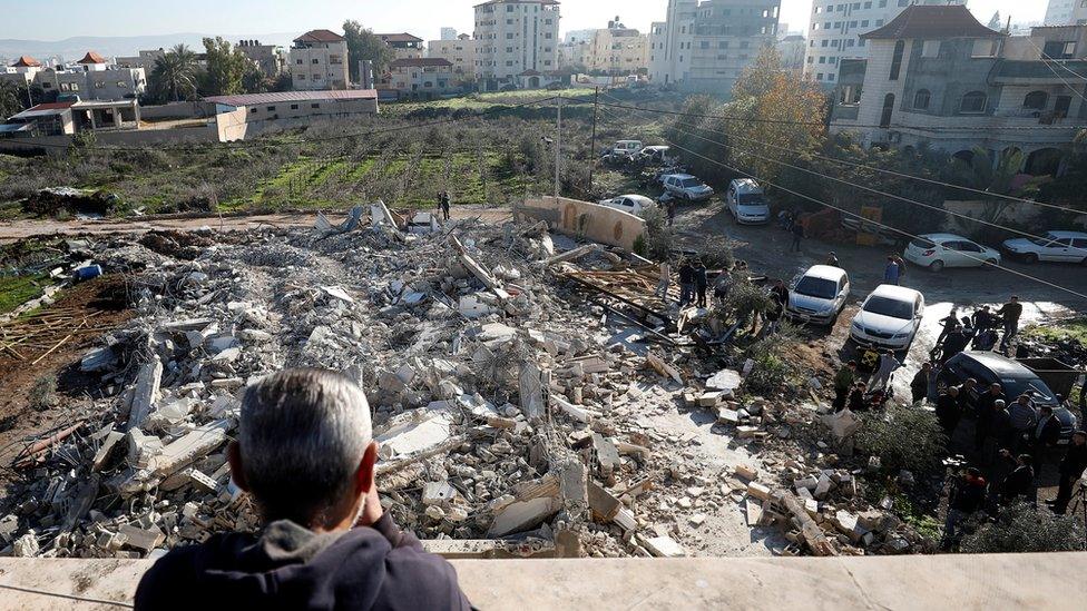 A man looks at the home of Ahmed al-Qanbaa after it was demolished by Israeli forces in the West Bank town of Jenin (6 February 2020)