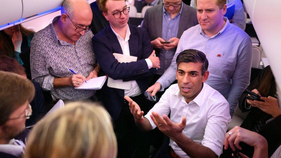 Prime Minister Rishi Sunak taking questions from reporters while on a plane to the G20 summit in Bali, Indonesia