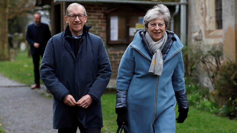 Prime Minister Theresa May and her husband Philip leave church