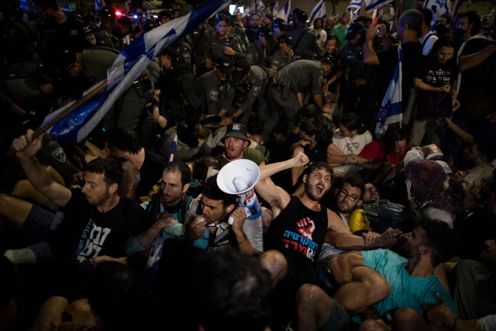 Protesters and Israeli police officers clash during a demonstration near the Israeli Knesset on July 24, 2023 in Jerusalem, Israel.