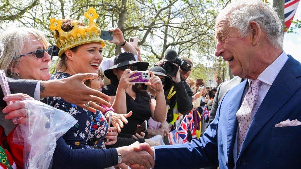 King Charles III meets well-wishers during a walkabout on the Mall outside Buckingham Palace ahead of his and Camilla, Queen Consort's coronationon May 5, 2023 in London, England