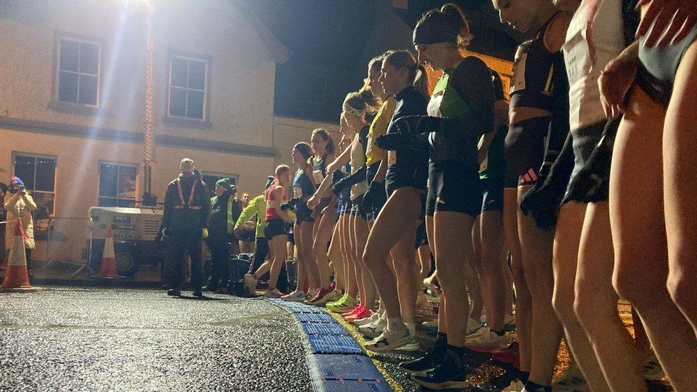 The Womens 3km race competitors on their marks at the start line