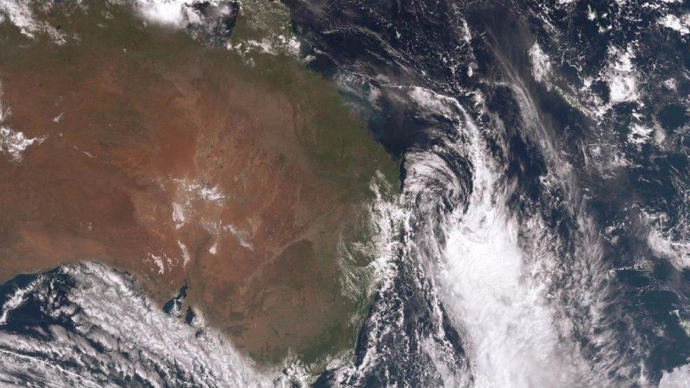 A satellite image showing the storm system moving out to sea.