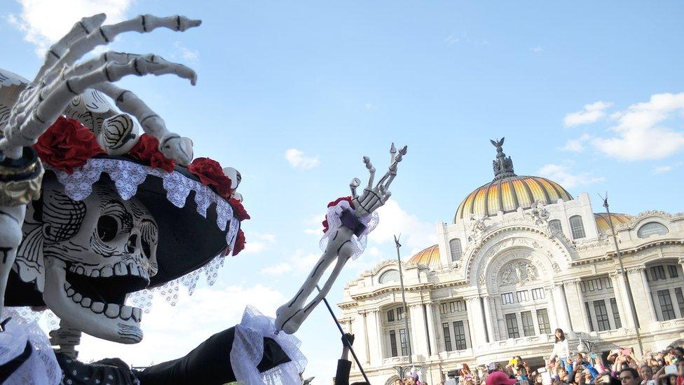 Floats depicting 'Catrinas' and other death related characters and offerings march during the first Big Parade of the City to celebrate the Day of the Dead in Mexico City on October 29, 2016.