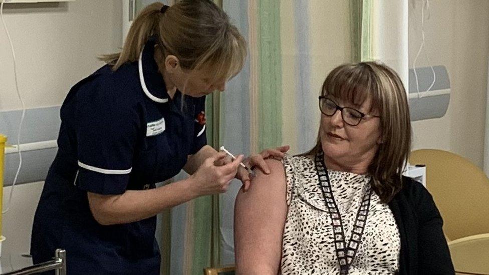 Sandie Hannay being given the vaccine