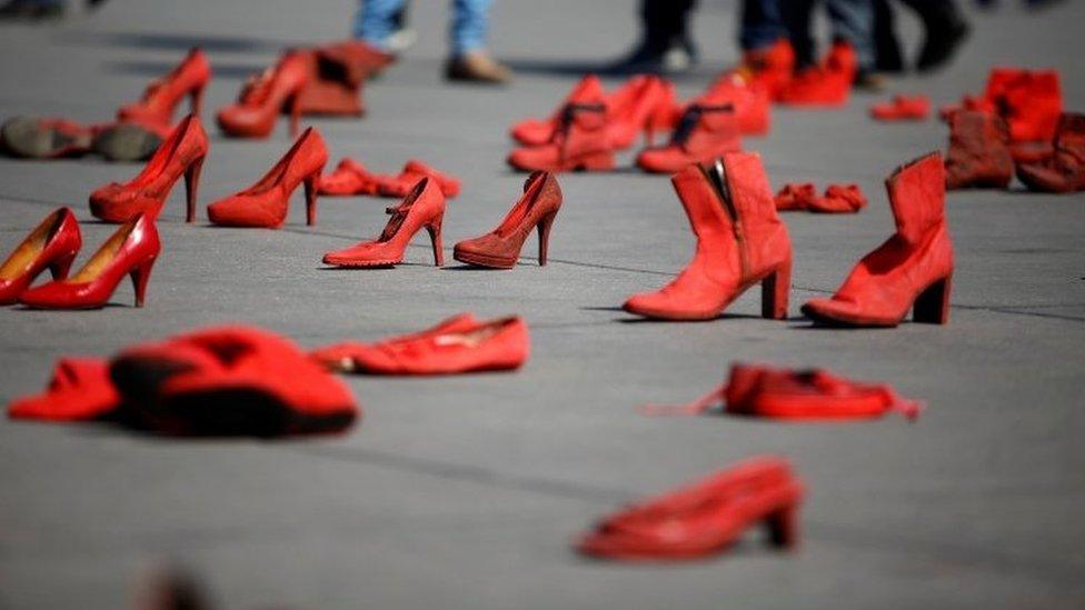 Pairs of women'S red shoes, put on display by Mexican visual artist Elina Chauvet to protest against gender violence and femicide, are pictured at Zocalo square in Mexico City, Mexico January 11, 20