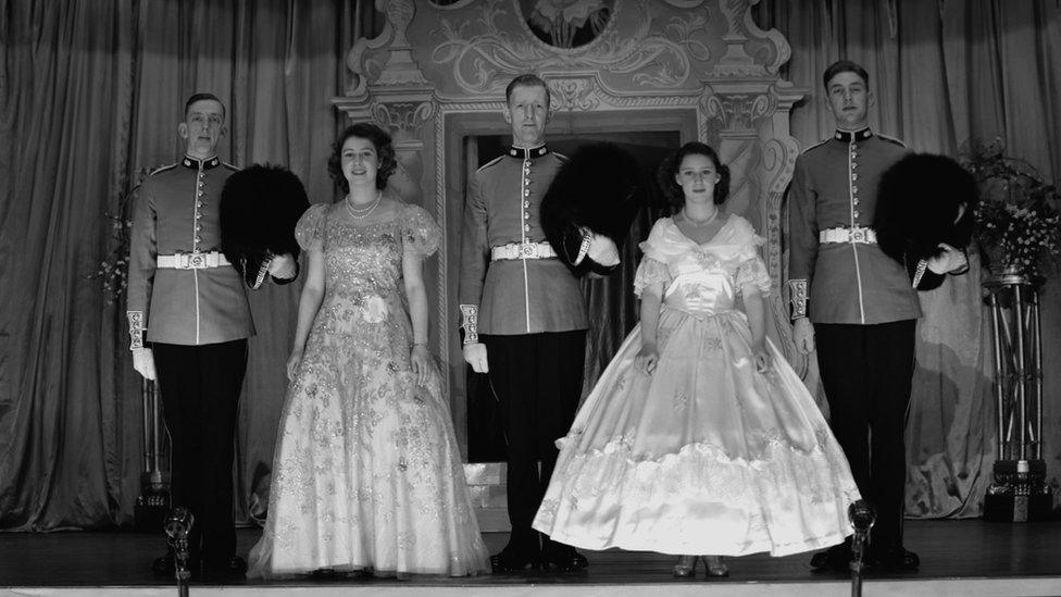 Queen Elizabeth II and Princess Margaret with guardsmen