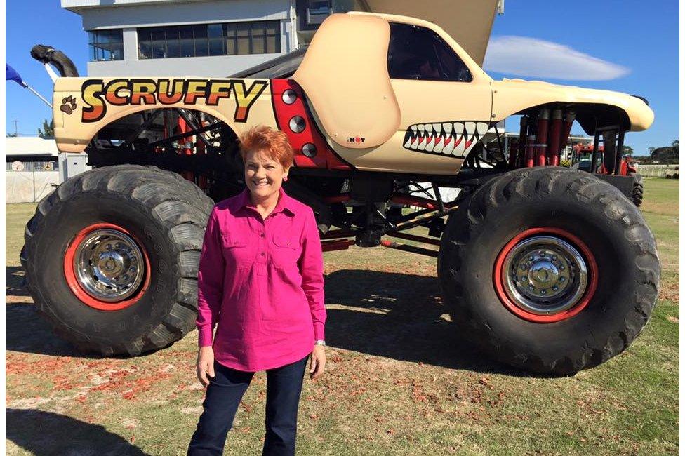 Pauline Hanson stands in front of a monster truck