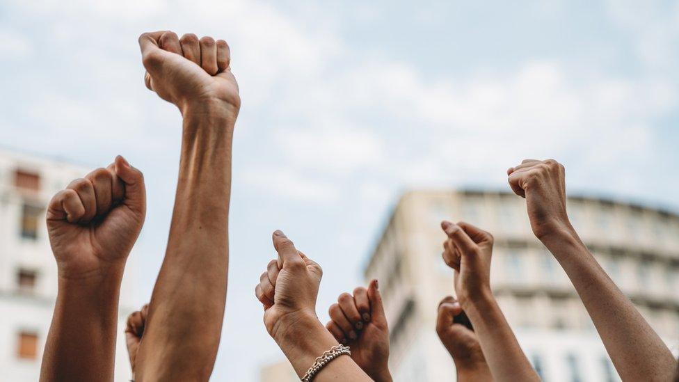 hands in the air as a sign of protest