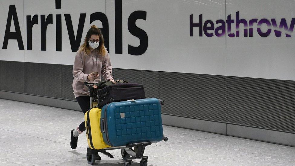 Passenger and sign at Heathrow