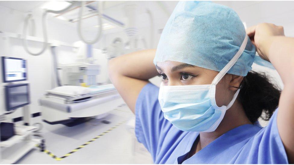 female doctor puts on mask