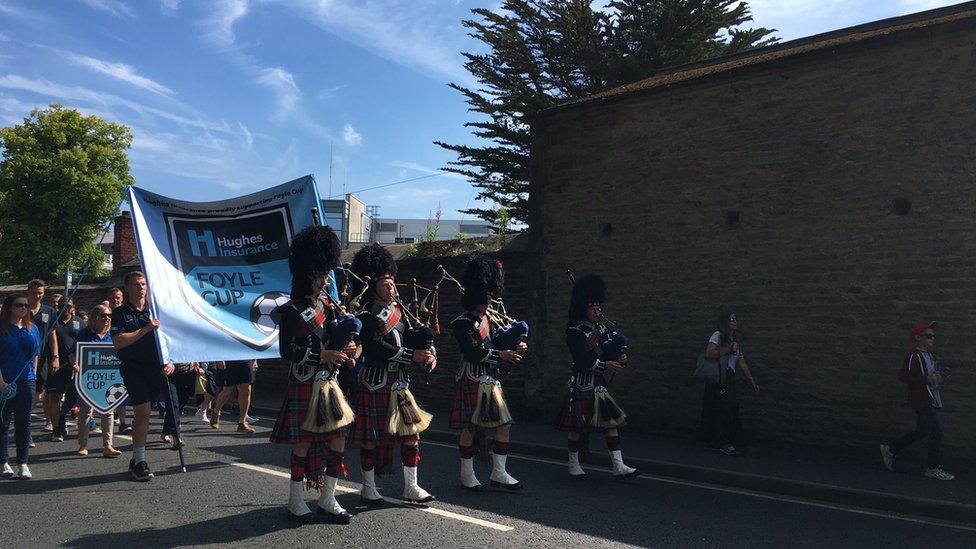 The skirl of bagpipes marks the start of the parade