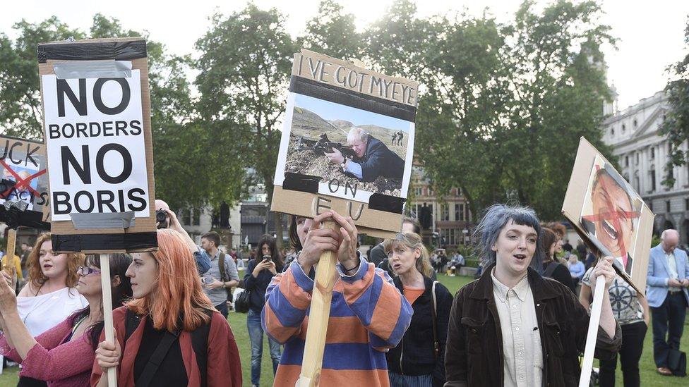 Protestors outside the Houses of Parliament following the leave result