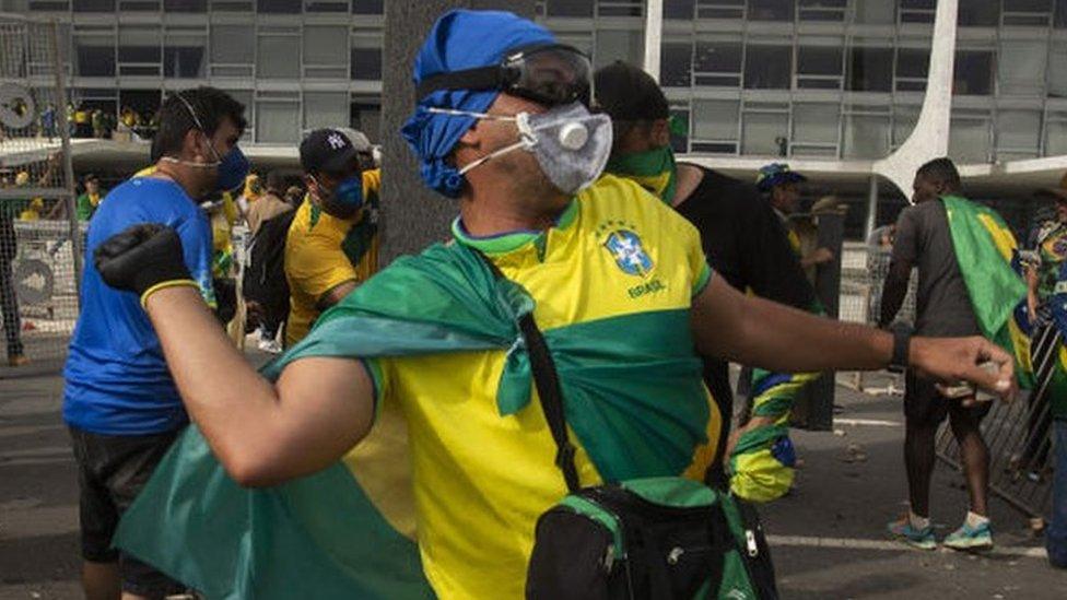 Supporters of former President Jair Bolsonaro clash with security forces as they raid the National Congress in Brasilia