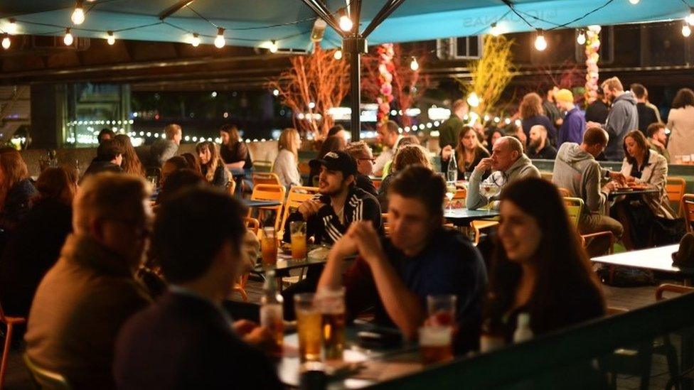 People drinking in a bar