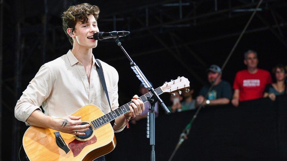 Shawn Mendes playing guitar