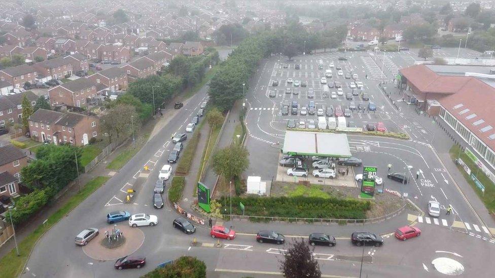 Motorists waiting to get into a filling station in Luton