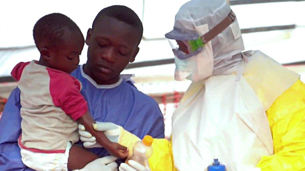 Child and health workers at Ebola centre