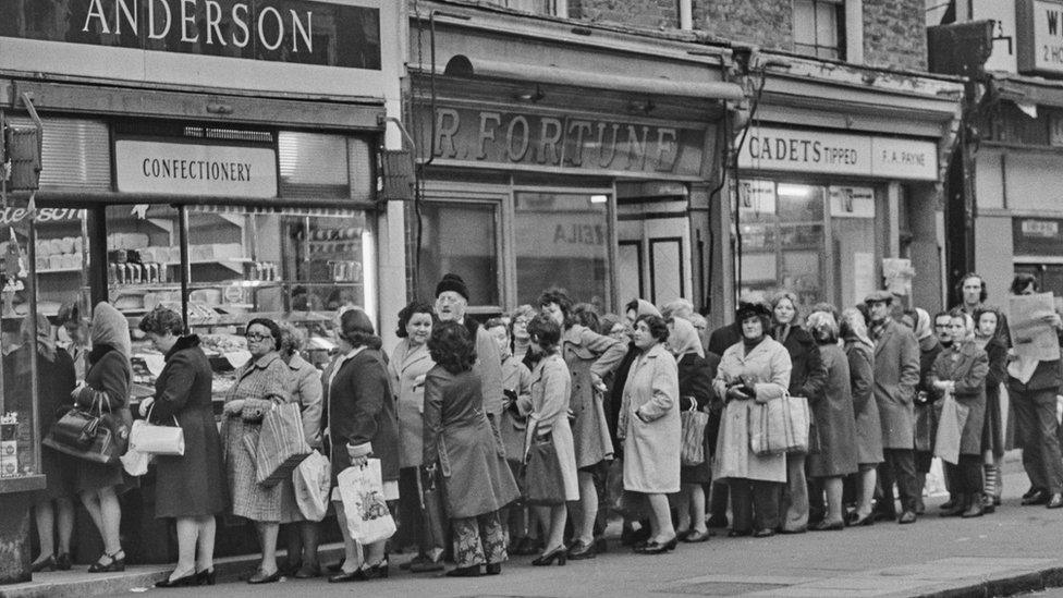 Customers queuing in front of a bakery in 1974