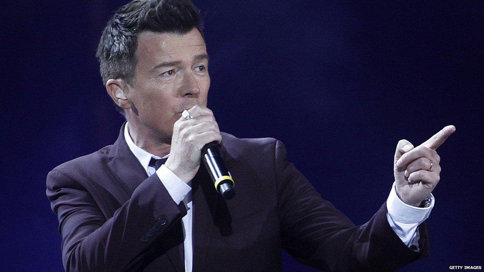 Rick Astley pointing over there.