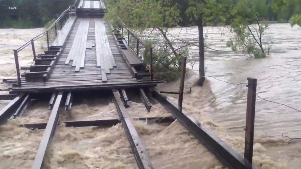 The Altai bridge damaged by floods