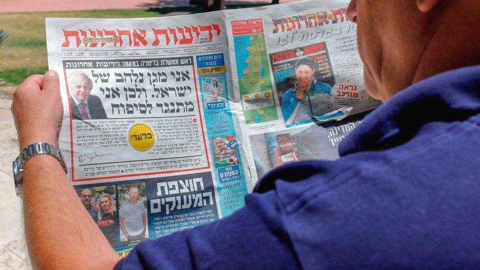 Israel's daily Yedioth Ahronoth, the country's leading daily newspaper, shows a headline from an interview by British Prime Minister Boris Johnson reading in Hebrew: "I am passionate defender of Israel that's why I oppose the annexation", in Jerusalem on July 1, 2020.