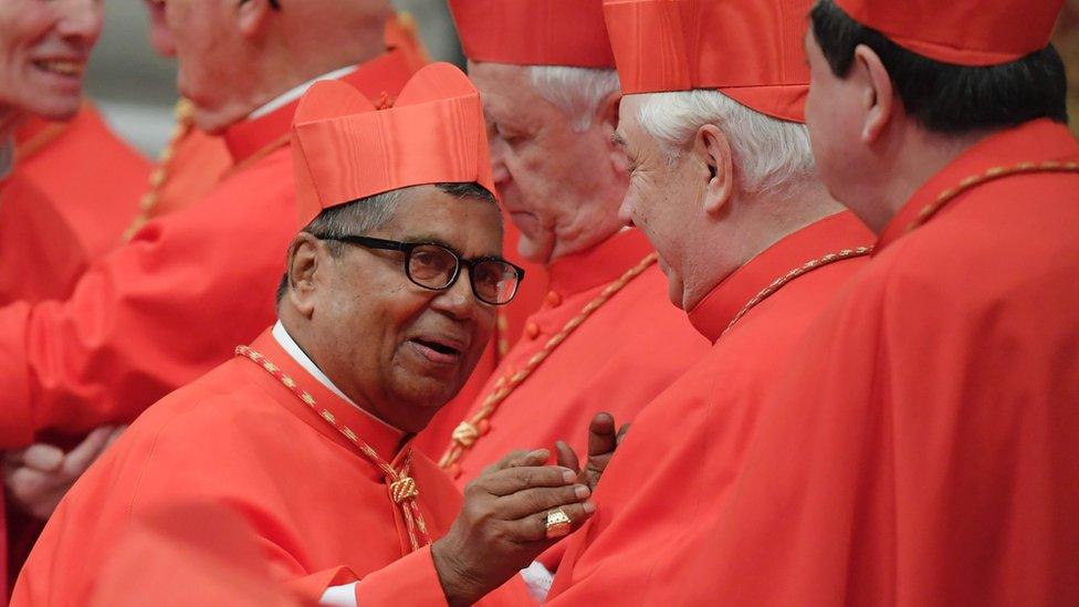 Newly nominated cardinal, archbishop of Kuala Lumpur, Anthony Soter Fernandez (L) is congratulated by others cardinals, on November 19, 2016