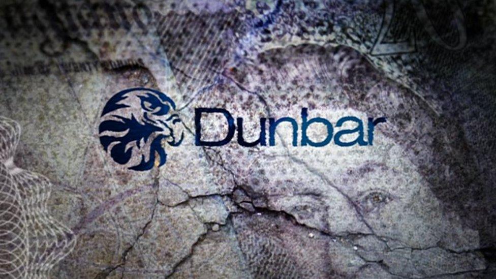 Dunbar bank logo on background of bank notes