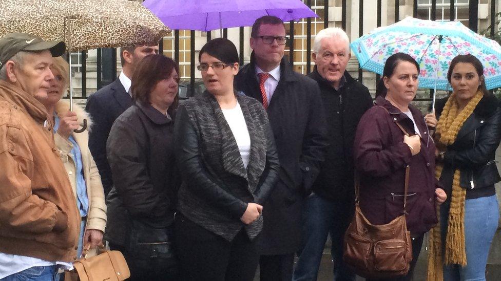 Families and legal representatives pictured outside court