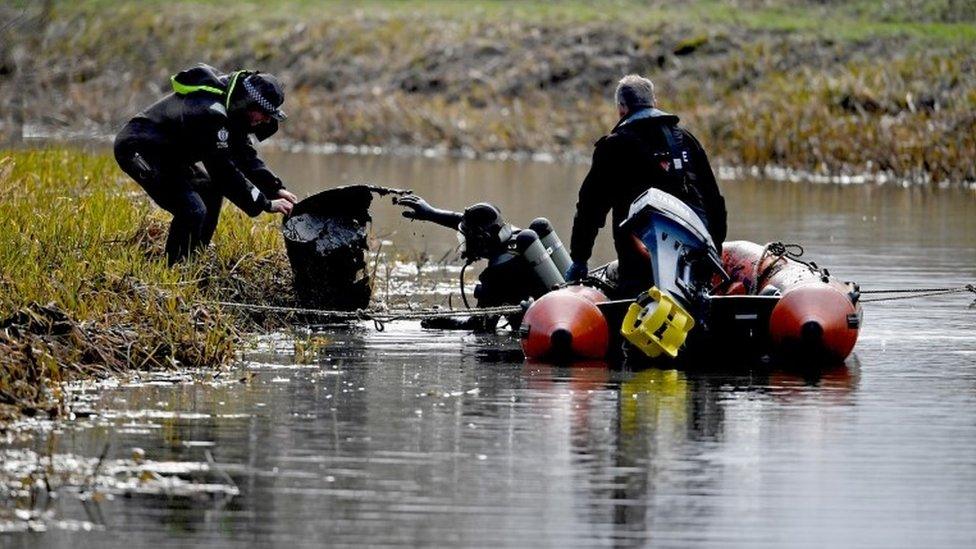 Divers on the water