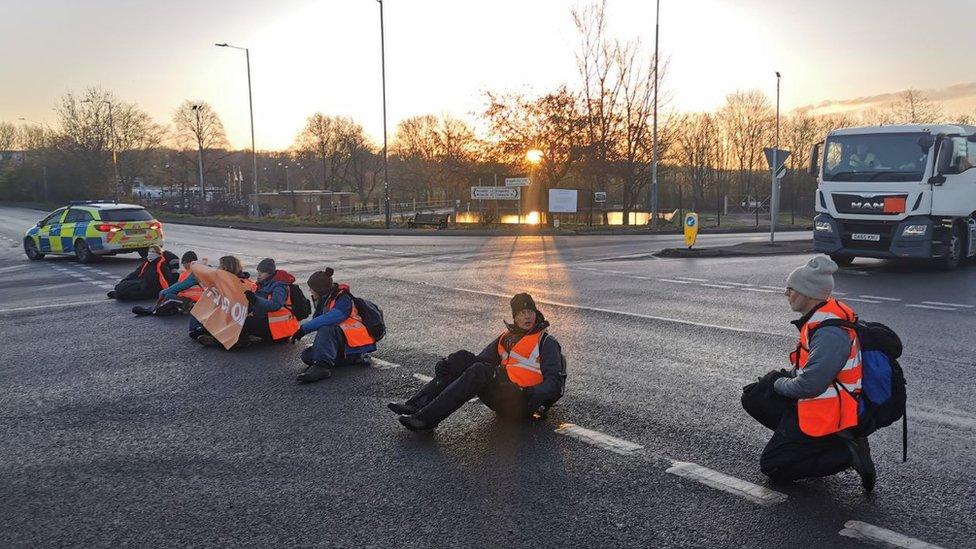 Handout photo issued by Just Stop Oil of their activists during one of their blockades at Kingsbury early on Friday