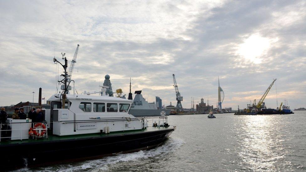 Mr Fallon was given a tour to see floating cranes dredging Portsmouth harbour