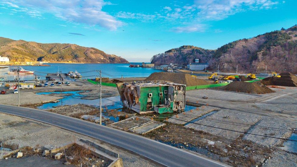 a toppled building in Onagawa port