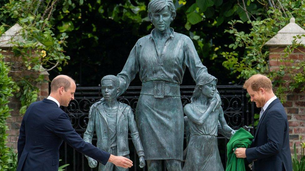 Prince Harry and Prince William next to the statue of Diana