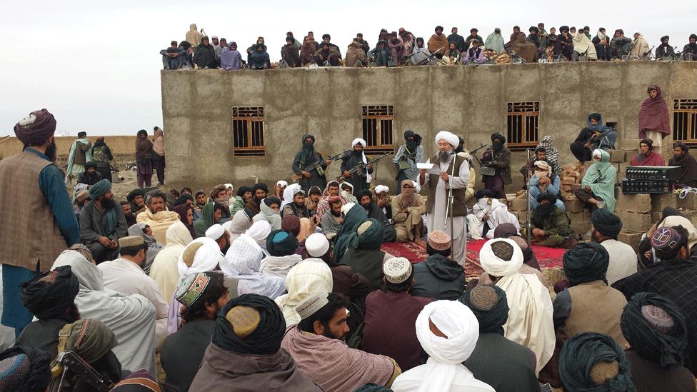 Mullah Niazi addresses Taliban fighters at the meeting in Farah