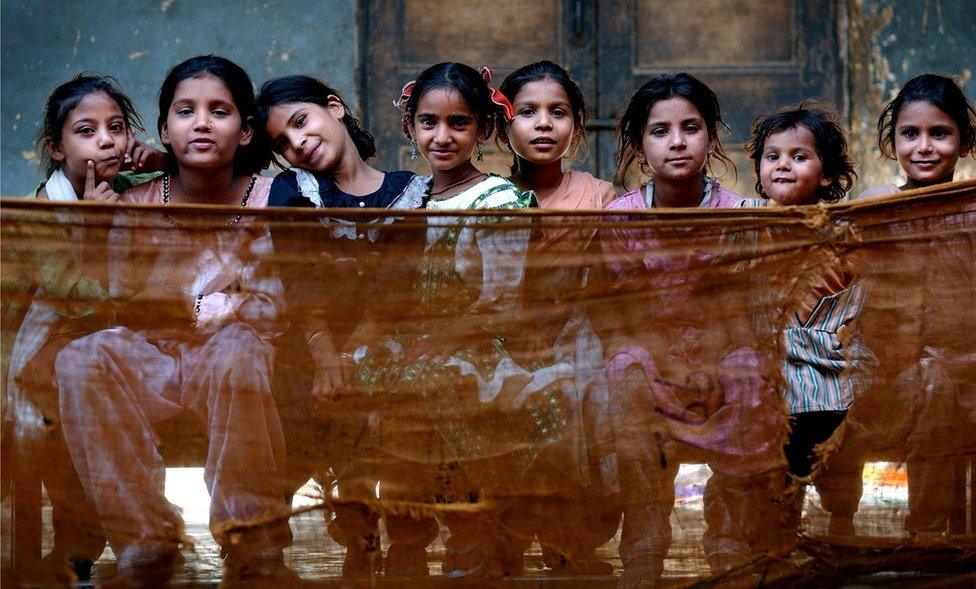 Children inside Dariya Khan Ghhumnat Rahat refugee camp set up outside a school in the state of Gujarat in Ahmedabad, India, 2002