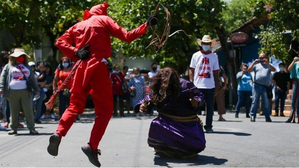 A man dressed as a demon participates in a ceremony known as Los Talciguines, as part of religious activities to mark the start of the Holy Week in Texistepeque, El Salvador, April 11, 2022.