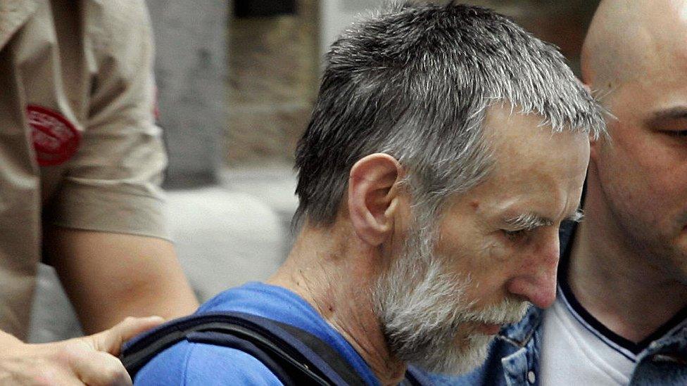 Self-confessed French serial killer Michel Fourniret leaves Police Headquarters in Dinant 08 July 2004.