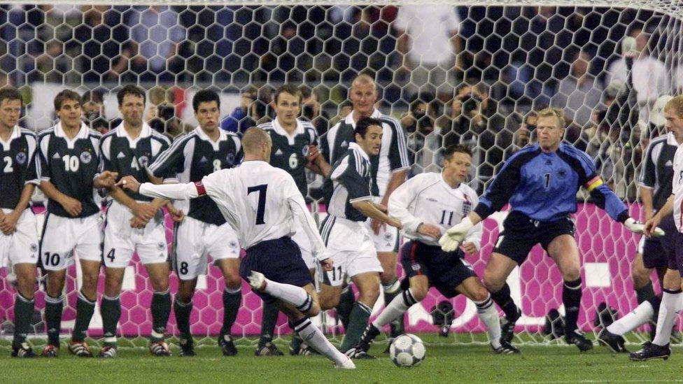 David Beckham takes freekick.