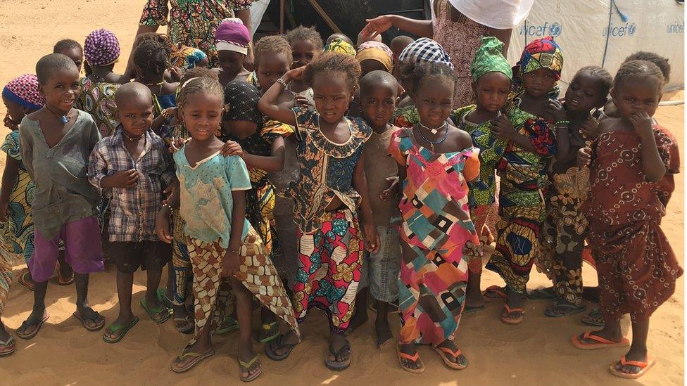 Children displaced by Boko Haram insurgency outside their makeshift school run by Unicef in a camp in Niger's Diffa region