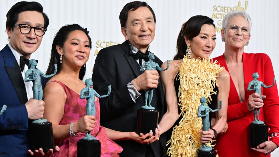 Actors Michelle Yeoh, Ke Huy Quan, Stephanie Hsu, Jamie Lee Curtis and James Hong pose with the award for Outstanding Performance by a Cast in a Motion Picture for "Everything Everywhere All at Once" during the 29th Screen Actors Guild Awards at the Fairmont Century Plaza in Century City, California, on February 26, 2023.