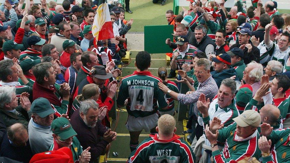 Martin Johnson walks through the fans to get to the pitch