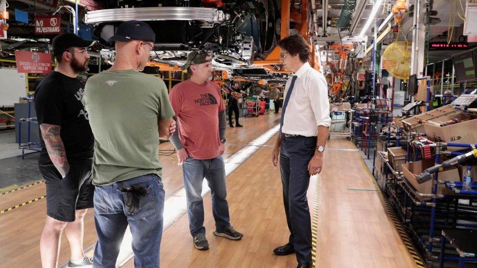 Prime Minister Justin Trudeau speaks with auto assembly workers