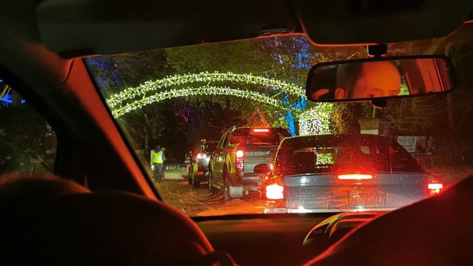 Queues of cars at drive-thru grotto