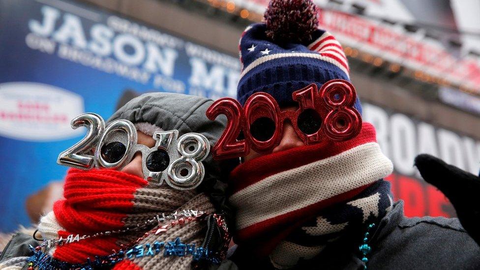 Revelers gather in Times Square as a cold weather front hits the region ahead of New Year"s celebrations in Manhattan, New York, U.S., December 31, 2017.