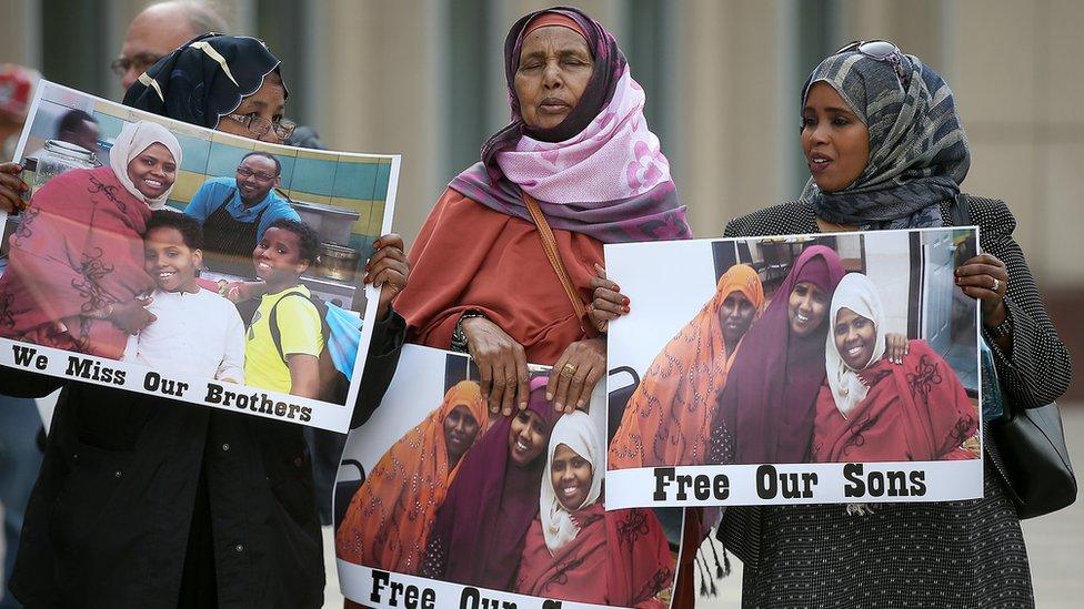 Outside a Minnesota courtroom, family members of the men on trial have gathered