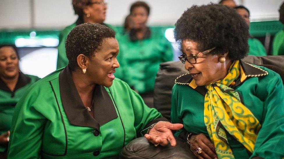 Africa National Congress stalwart Winnie Madikizela Mandela (R) listens to ANC Women League President Bathabile Dlamini