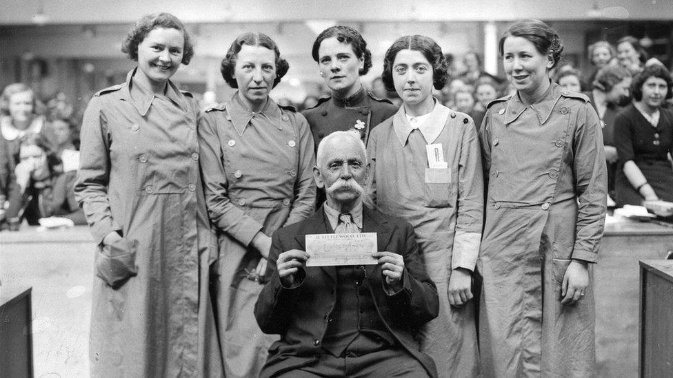 William Henry Whotton being presented with a cash cheque of £236 in 1938